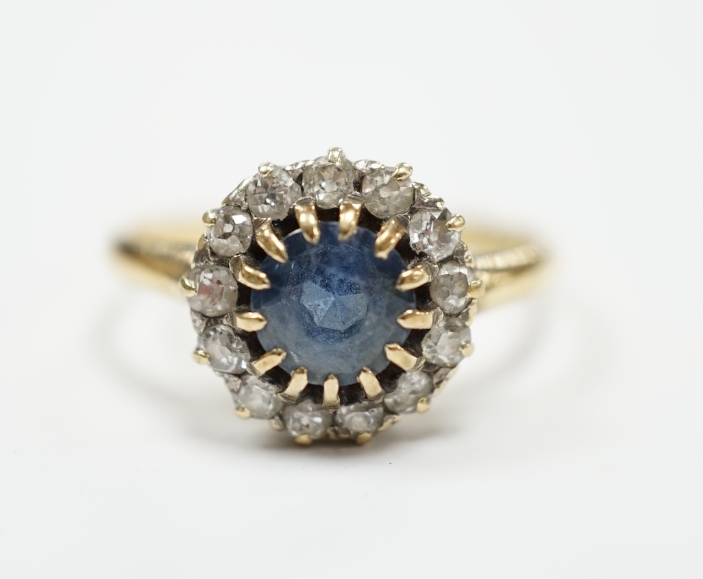 An early 20th century 18ct, sapphire and diamond set circular cluster ring, size P, gross weight 3.3 grams.